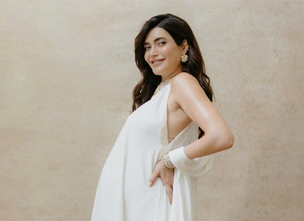 Pregnant-Karishma-Tanna-stuns-in-dreamy-white-maternity-photoshoot-news.jpeg